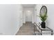 Inviting hallway featuring a modern glass table, bright lighting, and neutral wall color at 94 Mable Court # 16, Lillington, NC 27546