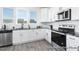 Bright kitchen with stainless steel appliances, granite countertops, and white cabinets at 94 Mable Court # 16, Lillington, NC 27546