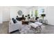 Bright living room featuring neutral tones, ample natural light, and modern decor at 94 Mable Court # 16, Lillington, NC 27546