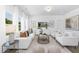 Bright living room with large windows, plush seating, and stylish decor creates a cozy atmosphere at 94 Mable Court # 16, Lillington, NC 27546