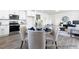 Open-concept living space with dining area, kitchen, and comfortable furniture at 94 Mable Court # 16, Lillington, NC 27546