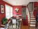 Bright breakfast nook with red walls and staircase access at 100 Lager Ln, Garner, NC 27529