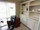 Organized home office with built-in bookshelves, work desk, and natural light at 100 Lager Ln, Garner, NC 27529