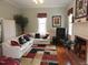 Cozy living room with fireplace, hardwood floors and ample natural light at 100 Lager Ln, Garner, NC 27529