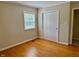 Bedroom with hardwood floors, natural light, and closet at 1005 Driftwood Dr, Siler City, NC 27344