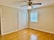 Bedroom with ceiling fan, window, closet, and wood floors at 1005 Driftwood Dr, Siler City, NC 27344