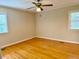 Bedroom featuring ceiling fan, window and hardwood floors at 1005 Driftwood Dr, Siler City, NC 27344