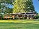 Charming single-story brick home with a well-maintained front yard at 1005 Driftwood Dr, Siler City, NC 27344
