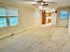 Spacious living room with natural light and carpeted floors at 1005 Driftwood Dr, Siler City, NC 27344