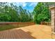 A backyard deck overlooking the lush yard at 1016 Luminary Ln, Willow Springs, NC 27592