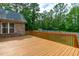 A back deck overlooking the lush green backyard at 1016 Luminary Ln, Willow Springs, NC 27592