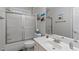 A bathroom featuring a shower with sliding glass doors, a toilet, and a vanity sink with a mirror at 1016 Luminary Ln, Willow Springs, NC 27592