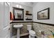 Stylish half bathroom featuring decorative tile, vanity sink, and modern fixtures at 10520 Sablewood Dr # 103, Raleigh, NC 27617