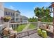 Deck offering a cozy seating area with views of a manicured lawn, ideal for relaxation at 10520 Sablewood Dr # 103, Raleigh, NC 27617
