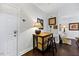 Inviting entryway with hardwood floors, stylish decor, and access to living areas at 10520 Sablewood Dr # 103, Raleigh, NC 27617