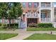 Charming brick townhouse featuring multiple floors, balconies, and well-maintained landscaping at 10520 Sablewood Dr # 103, Raleigh, NC 27617