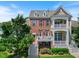 Charming two-story home with brick facade, double balconies and well-manicured landscaping at 10520 Sablewood Dr # 103, Raleigh, NC 27617