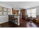 Open kitchen and dining area with granite countertops, a breakfast bar, and wood cabinets at 10520 Sablewood Dr # 103, Raleigh, NC 27617