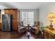 Cozy kitchen nook area with a table, chairs, stainless steel refrigerator, and a large window at 10520 Sablewood Dr # 103, Raleigh, NC 27617