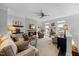 Cozy living room featuring a stone fireplace, plush seating, and a ceiling fan at 10520 Sablewood Dr # 103, Raleigh, NC 27617