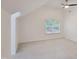 Sunlit bedroom features vaulted ceilings, a ceiling fan, and a view of the outdoors at 107 Long Shadow Ln, Cary, NC 27518