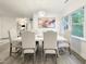 Bright dining room with modern chandelier and large window at 107 Long Shadow Ln, Cary, NC 27518