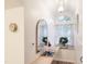 Bright entryway features a half-moon window, modern light fixture, and a mirror at 107 Long Shadow Ln, Cary, NC 27518