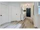Entryway featuring hardwood floors, console table, and a stylish front door at 107 Long Shadow Ln, Cary, NC 27518