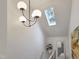 Bright hallway features modern light fixture, skylight, and a decorative mirror at 107 Long Shadow Ln, Cary, NC 27518