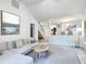 Open-concept living room with a staircase and views into dining area at 107 Long Shadow Ln, Cary, NC 27518