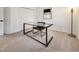 Bright office features a contemporary glass desk and sleek chair at 107 Long Shadow Ln, Cary, NC 27518