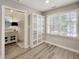 Bright office with large window, built-in storage and neutral tones, creating a comfortable and productive workspace at 107 Long Shadow Ln, Cary, NC 27518