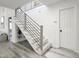 Contemporary staircase featuring sleek railings, modern lighting, and open design, enhancing the home's aesthetic appeal at 107 Long Shadow Ln, Cary, NC 27518