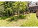 Serene backyard with lush greenery, a charming pond, and cozy seating offering a peaceful retreat at 108 Hanover Pl, Chapel Hill, NC 27516
