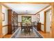 Spacious dining room featuring a large wood table, matching hutch, and an elegant area rug at 108 Hanover Pl, Chapel Hill, NC 27516