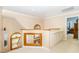 Hallway with natural light and display shelving that leads to other rooms at 108 Hanover Pl, Chapel Hill, NC 27516