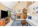 Bright living room featuring a fireplace, vaulted ceilings, and large windows at 108 Hanover Pl, Chapel Hill, NC 27516