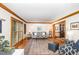 Bright and airy living room with hardwood floors, gray couches, and a decorative patterned rug at 108 Hanover Pl, Chapel Hill, NC 27516