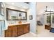 A main bathroom featuring a double sink vanity with stone countertops at 108 Hanover Pl, Chapel Hill, NC 27516