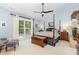 Serene main bedroom with four-poster bed, fireplace, natural light, and neutral paint at 108 Hanover Pl, Chapel Hill, NC 27516