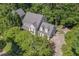 An aerial view of a beautiful property nestled among mature trees and lush landscaping at 108 Hotelling Ct, Chapel Hill, NC 27514