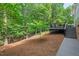 Expansive backyard with lush greenery and a deck, providing a private and serene oasis at 108 Hotelling Ct, Chapel Hill, NC 27514