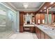 Elegant bathroom with dual sinks, marble countertops, and a glass enclosed shower at 108 Hotelling Ct, Chapel Hill, NC 27514