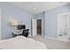 Comfortable bedroom with attached bathroom, carpet, and a ceiling fan at 108 Hotelling Ct, Chapel Hill, NC 27514