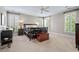 Spacious bedroom featuring three bright windows with shutters and neutral carpet at 108 Hotelling Ct, Chapel Hill, NC 27514