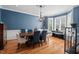 Elegant dining room features hardwood floors, blue walls, and natural light at 108 Hotelling Ct, Chapel Hill, NC 27514