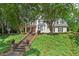 Charming two-story home features an attractive front entrance and lush landscaped yard at 108 Hotelling Ct, Chapel Hill, NC 27514