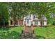 Charming two-story home features an attractive front entrance and lush landscaped yard at 108 Hotelling Ct, Chapel Hill, NC 27514