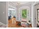 Welcoming foyer showcases hardwood floors, an open doorway, and garden views at 108 Hotelling Ct, Chapel Hill, NC 27514