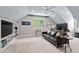 Cozy upstairs living room with a large sofa and built-in shelving at 108 Hotelling Ct, Chapel Hill, NC 27514
